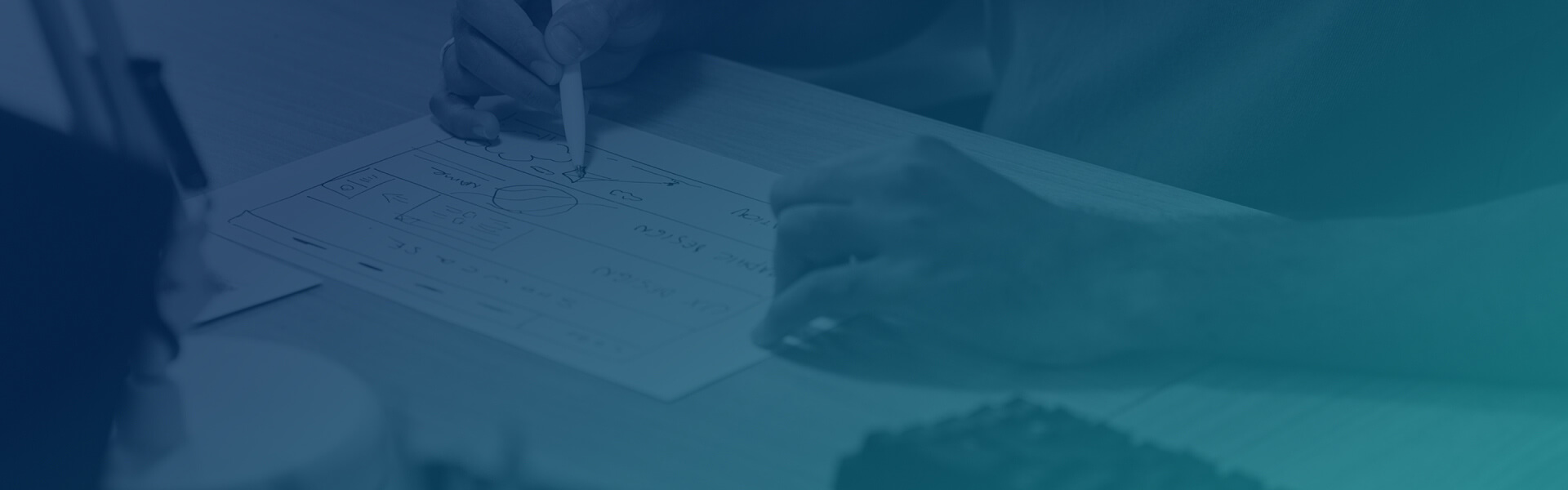 A person is writing on a piece of paper.