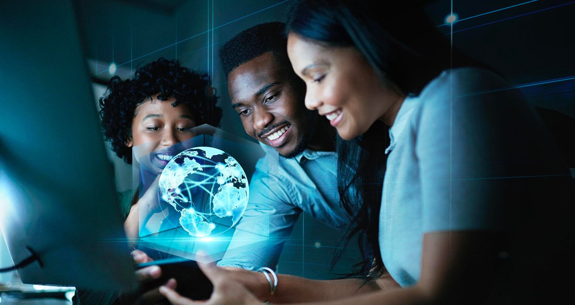 A group of people looking at a computer screen with a globe on it.